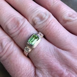 Never worn sterling silver ring with green stone.